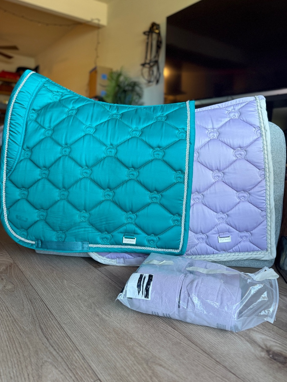 A bundle of two PS of Sweden dressage saddle pads